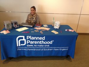 Jennifer Gaines a youth development coordinator and educator at Planned Parenthood mans the table.  (Photo by Victoria Tomis) 