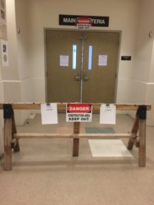 The two entrances to the cafeteria are surrounded with warning signs to keep students from trying to enter (Photo by author.) 